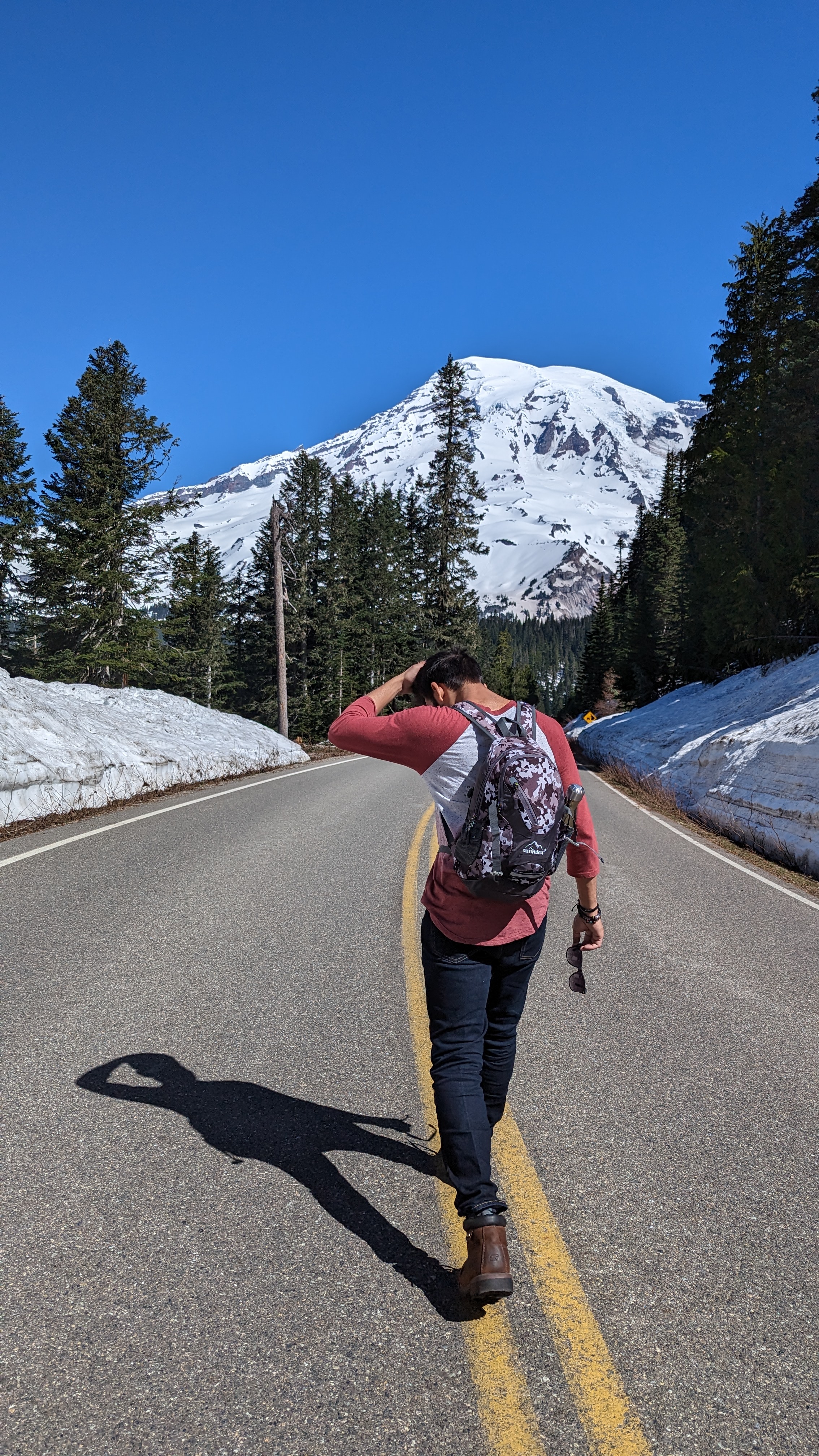 Abhishek walking on a mountain road